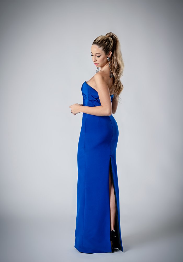 Cobalt blue silk crepe strapless evening gown with draped bodice, built-in corset, column skirt, and back slit.