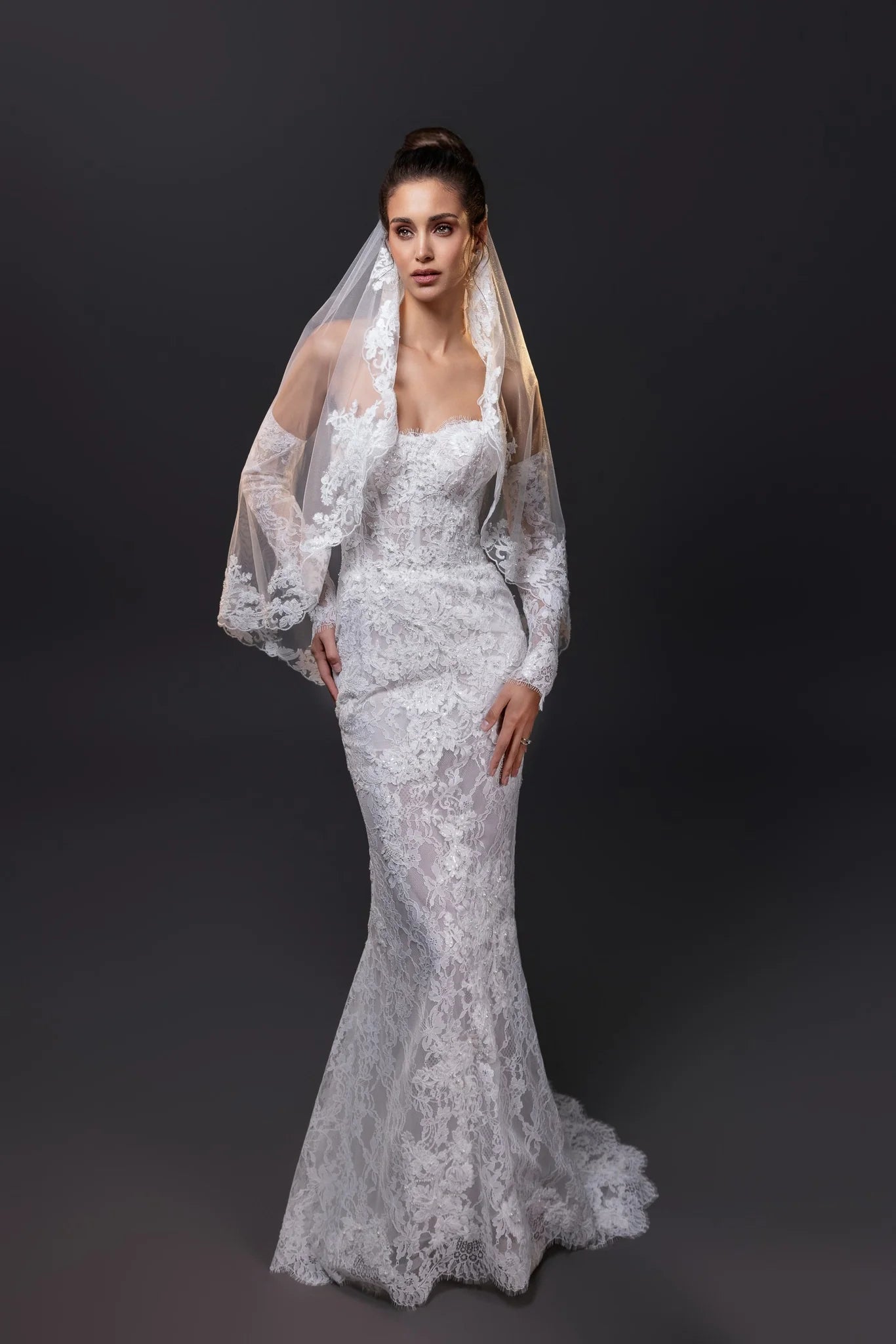 Francesca beaded lace strapless mermaid wedding gown with hand-cut appliqués, built-in corset, and dramatic lace train in Toronto.