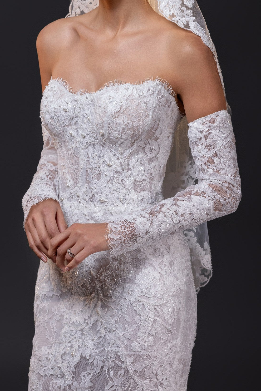 Francesca lace appliqué fingertip bridal veil with scalloped edges, styled with the Francesca gown in Toronto.