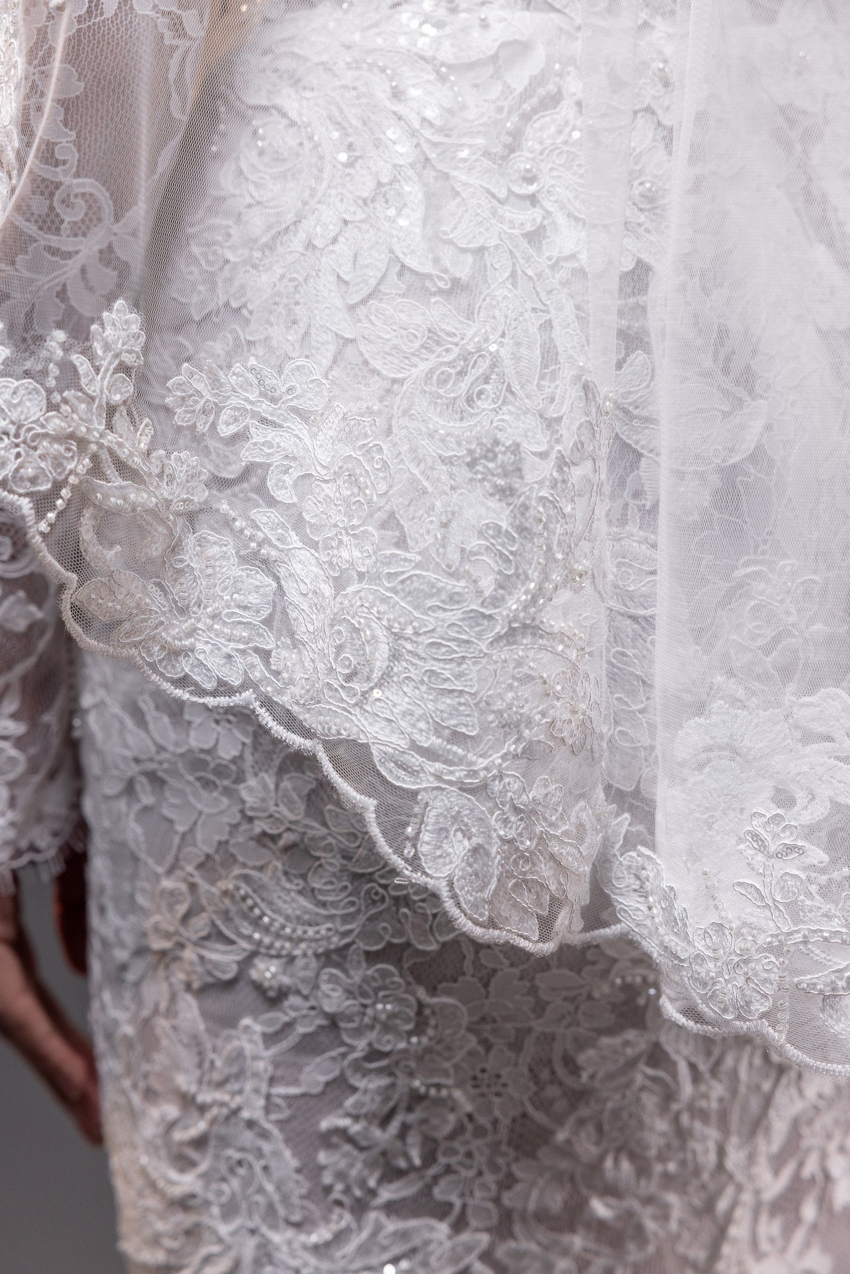 Francesca lace appliqué fingertip bridal veil with scalloped edges, styled with the Francesca gown in Toronto.