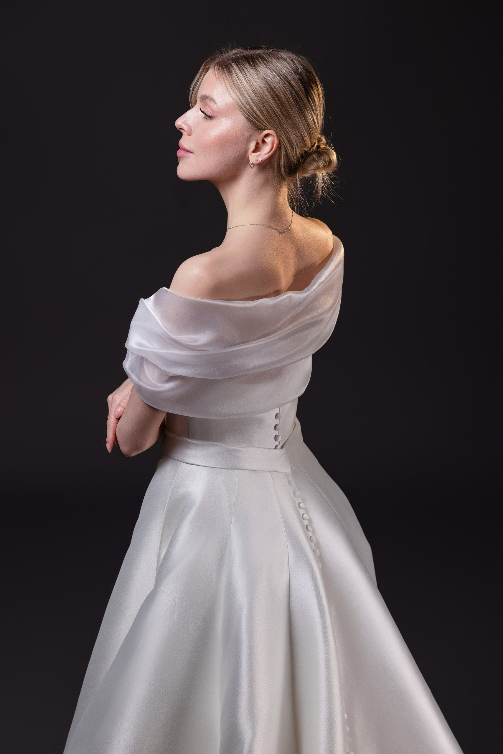 Mirabel removable organza bridal shawl draped off the shoulders, designed to complement the Mirabel Gown in Toronto.