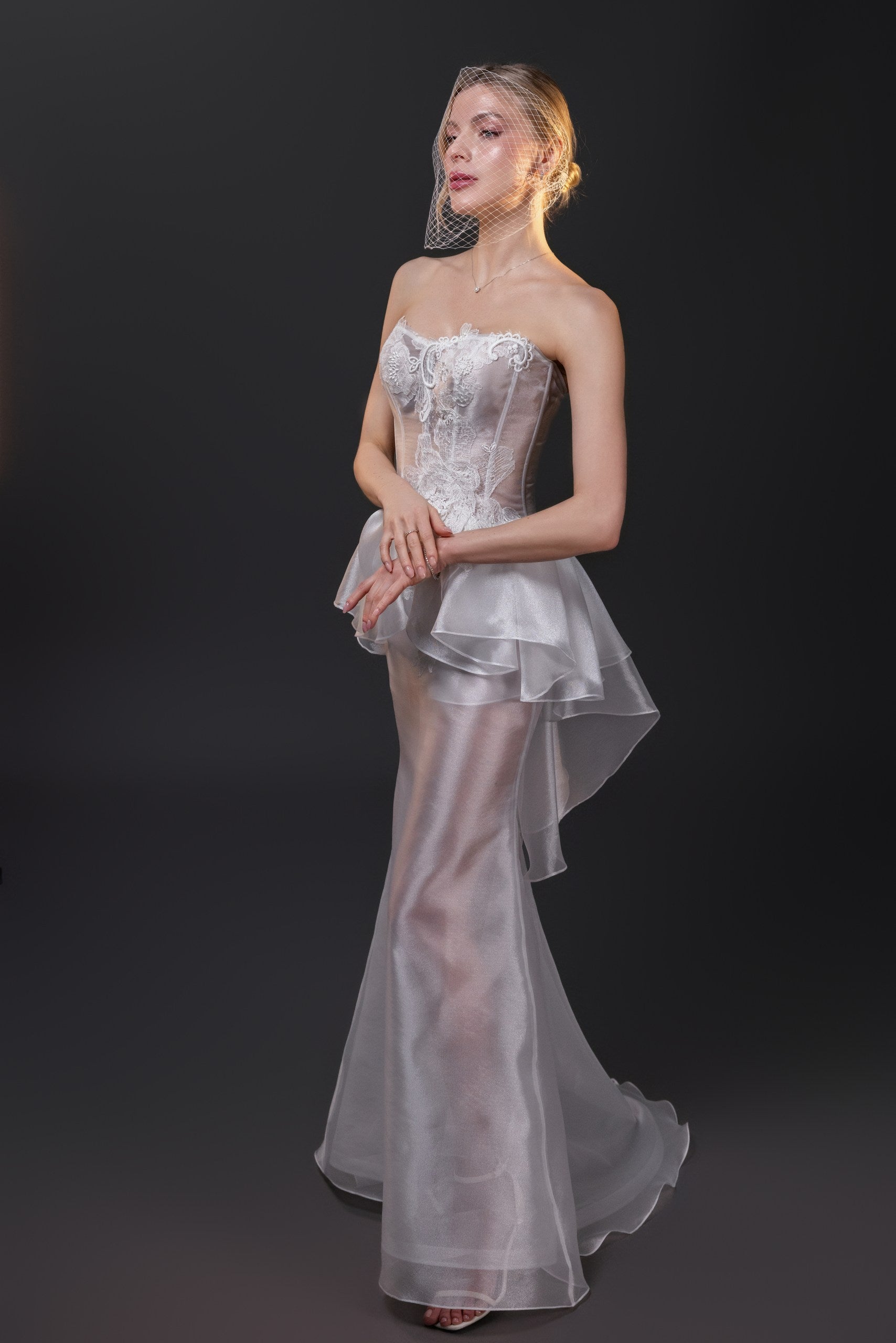 Olivia transparent textured organza fit and flare wedding gown with a boned corset and hand-cut silk flowers, Toronto.