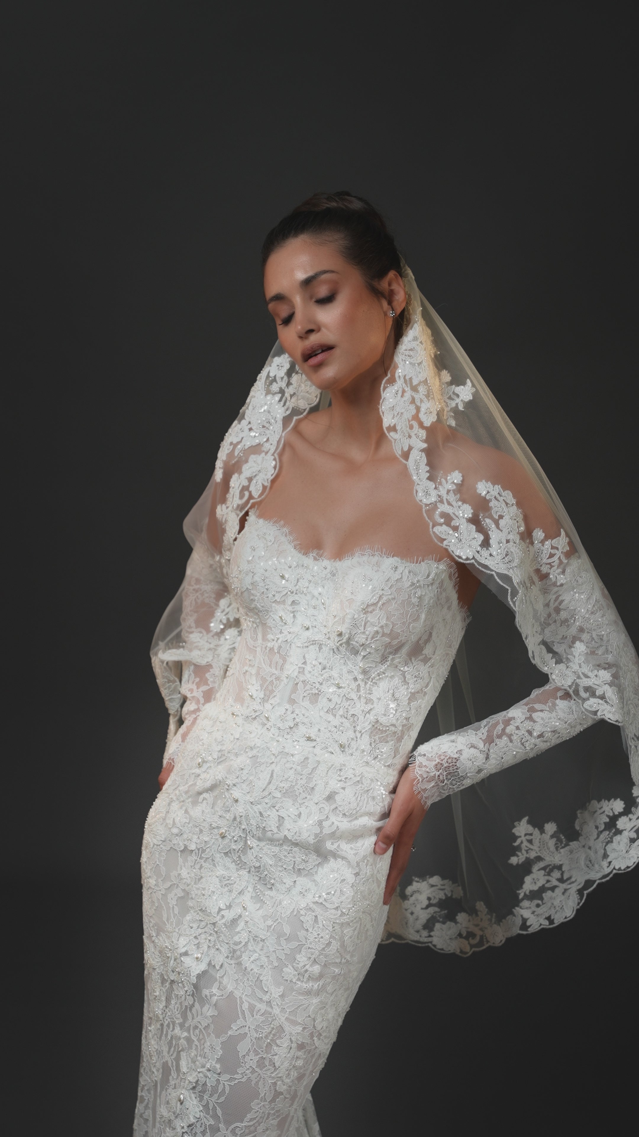 Francesca beaded lace strapless mermaid wedding gown with hand-cut appliqués, built-in corset, and dramatic lace train in Toronto.